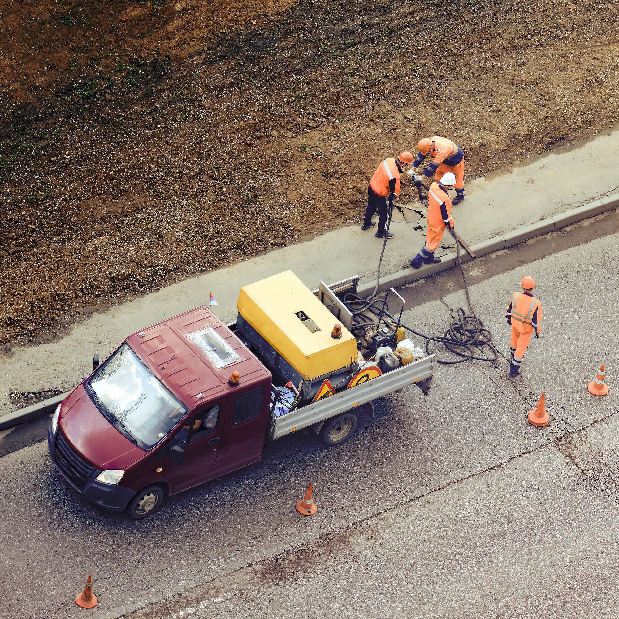 road-crew-working-on-asphalt-road-with-truck-2026-09-24-21-53-19-utc